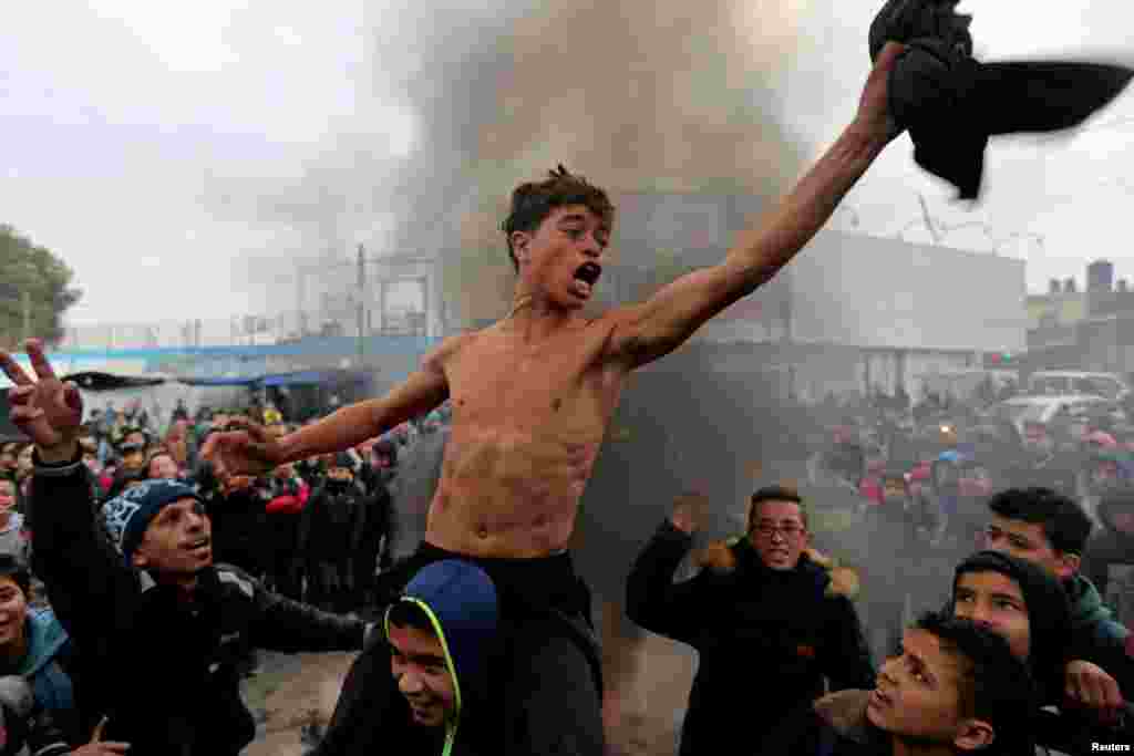 Palestinian students take part in a protest against the U.S. President Donald Trump&#39;s Middle East peace plan, in the southern Gaza Strip.