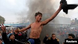 Palestinian students take part in a protest against the U.S. President Donald Trump&#39;s Middle East peace plan, in the southern Gaza Strip.