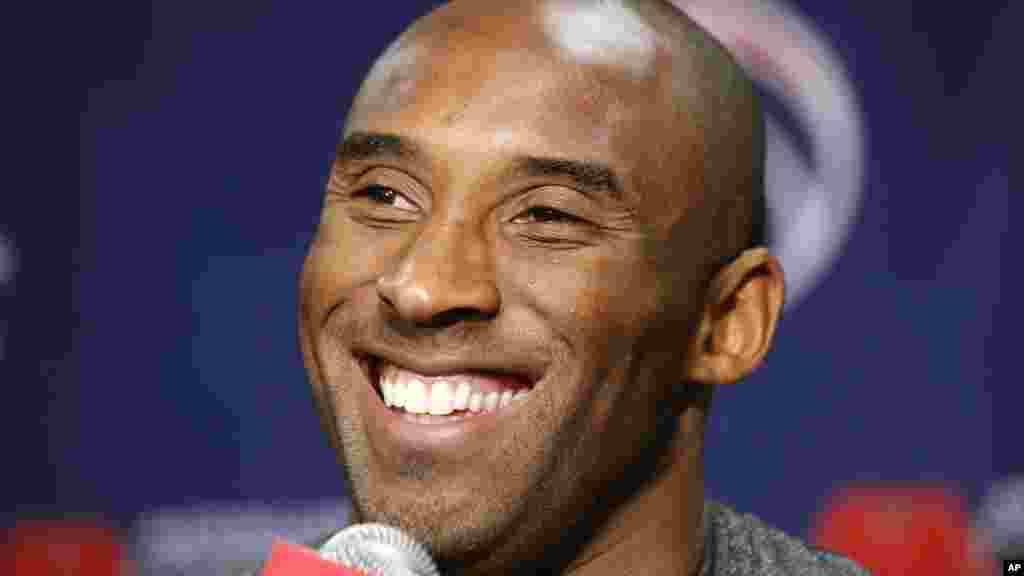 Los Angeles Lakers guard Kobe Bryant smiles during a media availability before an NBA basketball game against the Washington Wizards, Nov. 26, 2013, in Washington.