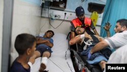 A wounded Palestinian lies in a hospital bed after taking part in a protest at Israel-Gaza border east of Gaza City, Aug. 21, 2021.