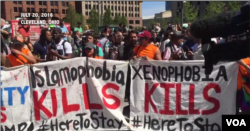 FILE - Pro-immigration demonstrators protest the immigration stance of Republican presidential nominee Donald Trump, in Public Square in Cleveland, July 20, 2016.