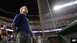 Former president George W. Bush is seen at a baseball game in Arlington, Texas, in this July 19, 2013, file photo.