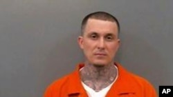 In this undated booking photo provided by the Jefferson County, Ark., Sheriff's Office, July 31, 2019 shows Wesley Gullett, a leader of a white supremacist gang in Arkansas.