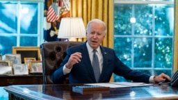 FILE - President Joe Biden speaks before signing an executive order to improve government services, in the Oval Office of the White House, Dec. 13, 2021, in Washington. 