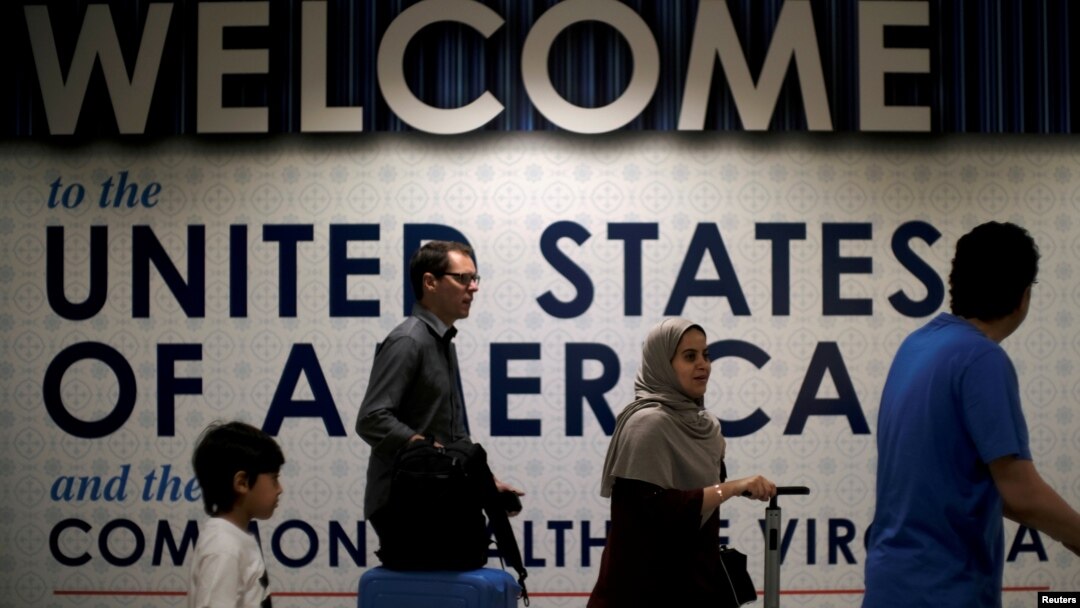 International passengers arrive at Washington Dulles International Airport after the U.S. Supreme Court granted parts of the Trump administration's emergency request to put its travel ban into effect later in the week pending further judicial review, in Dulles, Virginia, June 26, 2017.