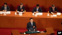 FILE - Wang Chen of the National People's Congress Standing Committee explains the draft decision on establishing and improving the legal system and enforcement mechanisms for Hong Kong, before the National People's Congress in Beijing, May 22, 2020.