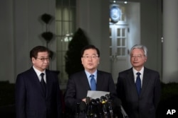 South Korean national security director Chung Eui-yong, center, speaks to reporters at the White House in Washington, March 8, 2018.