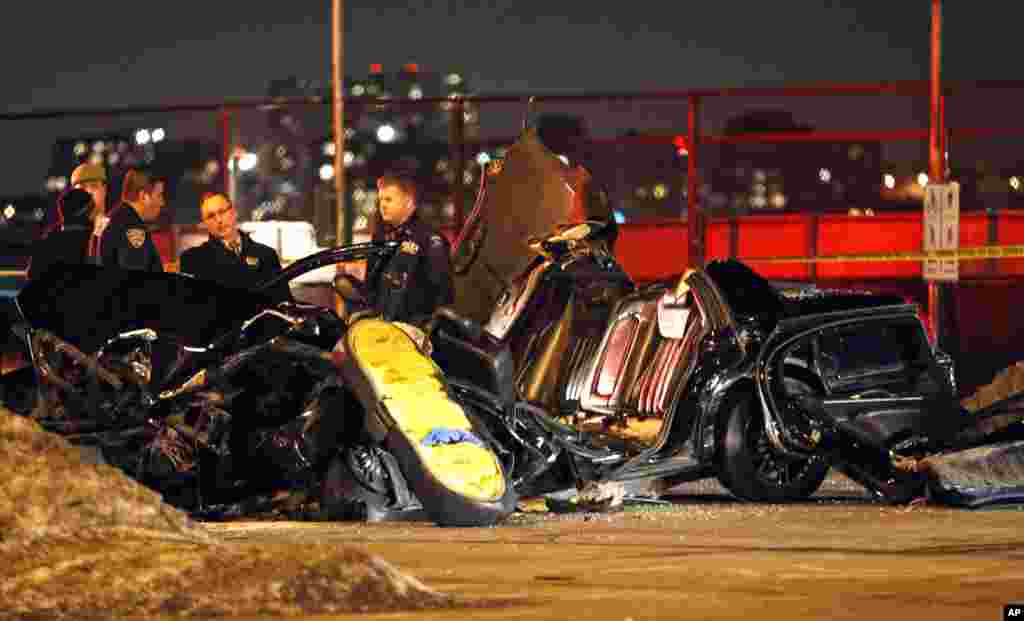 Officials stand by the scene of a fatal collision that killed longtime CBS &quot;60 Minutes&quot; correspondent Bob Simon in New York, Feb. 11, 2015. Simon, who was 73, covered riots, Academy Award-nominated movies and wars and was held captive for more than a month in Iraq two decades ago.