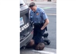 FILE - In this Monday, May 25, 2020, file frame from video provided by Darnella Frazier, a Minneapolis officer kneels on the neck of George Floyd, a handcuffed man who was pleading that he could not breathe.