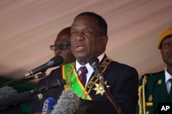 FILE - Zimbabwean President Emmerson Mnangagwa addresses people during a Heroes' Day holiday event to commemorate the lives of those who died in the southern African country's 1970s war against white minority rule, in Harare, Aug. 13, 2018.