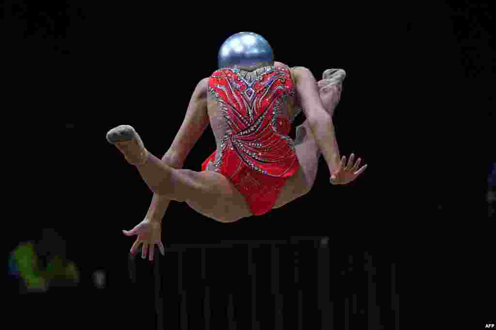 China's Zhao Yating competes with a ball in the women's rhythmic gymnastics individual all-around event during the 2018 Asian Games in Jakarta, Indonesia.
