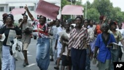 FILE: Members of the Women of Zimbabwe Arise (WOZA) group, march on the streets of Harare, Thursday, Nov. 17, 2005. (AP Photo)