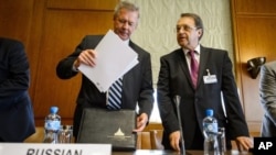 Russian Deputy Foreign Minister Gennady Gatilov (L) and Russian Deputy Foreign Minister Mikhail Bogdanov arrive at the United Nations office in a bid to organize the conference on Syria, in Geneva, June 2013.