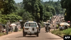 An ambulance carries the remains of an Ebola victim towards a burial site in Mbandaka on May 22, 2018, in the Democratic Republic of Congo.