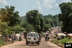 An ambulance carries the remains of an Ebola victim to a burial site in Mbandaka on May 22, 2018, in the Democratic Republic of Congo.