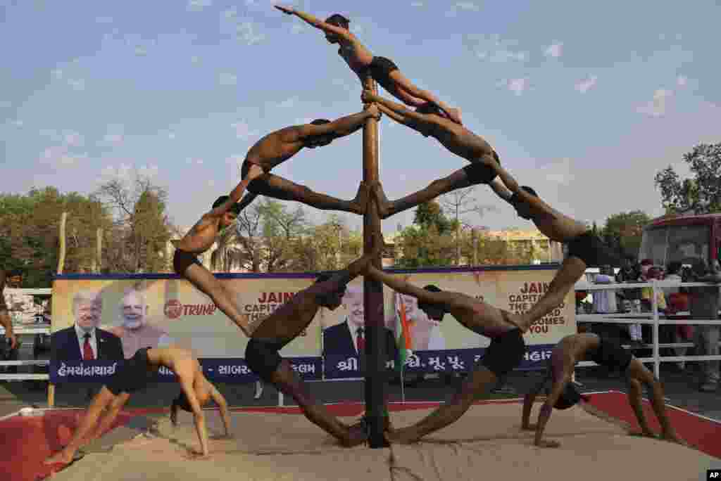 Indian children perform Mallakhamb, a traditional training exercise for wrestlers in Ahmedabad.