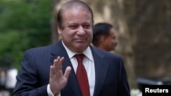 FILE - Pakistan's Prime Minister Nawaz Sharif waves as he arrives in Downing Street in London, April 2014.