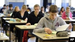 In this file photo, students participate in the Abitur exam in Ravenburg, southern Germany, on Thursday, April 3, 2008. (AP Photo/Felix Kaestle)