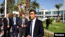 FILE - British Prime Minister Rishi Sunak speaks to the media after landing at Ben Gurion international airport in Lod, Near Tel Aviv, Israel October 19, 2023.