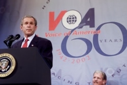 President George W. Bush speaks at a celebration for the 60th anniversary for the Voice of America February, 25, 2002.