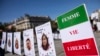 This photograph shows a slogan reads "Women, Life, Freedom" during a march on the second anniversary of a protest movement sparked by the death in custody of Mahsa Amini, in Paris, Sept. 15, 2024. 