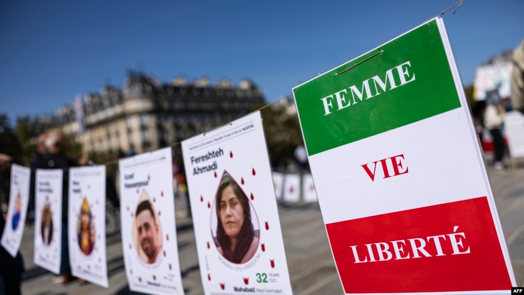 This photograph shows a slogan reads "Women, Life, Freedom" during a march on the second anniversary of a protest movement sparked by the death in custody of Mahsa Amini, in Paris, Sept. 15, 2024. 