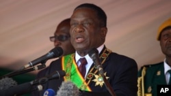FILE - Zimbabwean President Emmerson Mnangagwa addresses people during a Heroes' Day holiday event in Harare, Aug. 13, 2018. Friday, the country's top court confirmed Mnangagwa's election victory, clearing the way for his inauguration.