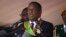 FILE - Zimbabwean President Emmerson Mnangagwa addresses people during a Heroes' Day holiday event in Harare, Aug. 13, 2018. Friday, the country's top court confirmed Mnangagwa's election victory, clearing the way for his inauguration.