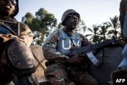 FILE - A South African soldier from the United Nations Stabilization Mission in the Democratic Republic of the Congo (MONUSCO) is seen during a patrol to hold off attacks by the Allied Democratic Forces rebels in Oicha, DRC, Oct. 08, 2018.