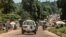 An ambulance carries the remains of an Ebola victim towards a burial site in Mbandaka on May 22, 2018, in the Democratic Republic of Congo.
