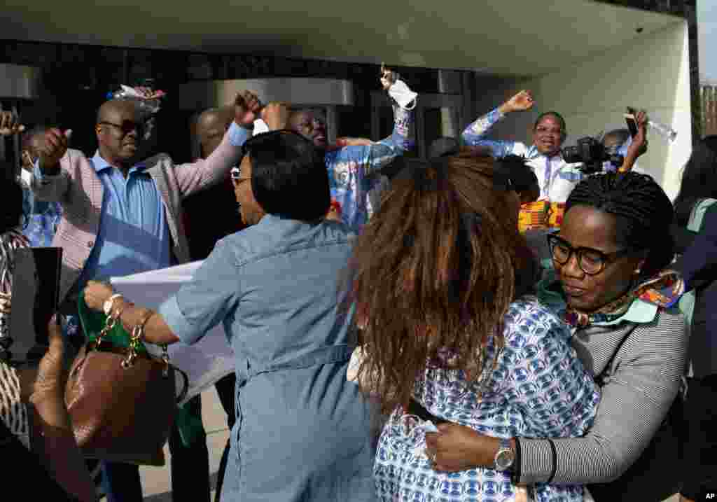 Supporters of former Ivory Coast President Laurent Gbagbo and former youth minister Charles Ble Goude, celebrate their acquittal outside the International Criminal Court in The Hague, Netherlands.