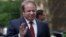 FILE - Pakistan's Prime Minister Nawaz Sharif waves as he arrives in Downing Street in London, April 2014.