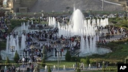 FILE - A photo shows a downtown park with fountains in Irbil, Iraqi Kurdistan's capital, during somewhat better economic times, Sept. 22, 2013.