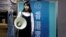 FILE - Student activist Agnes Chow poses before her campaign to join the Legislative Council in the March election, at the Demosisto party office in Hong Kong, Dec. 8, 2017.