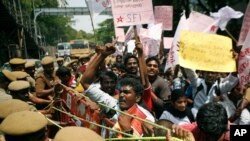 India Tamil activists try to push past a barricade during a protest against alleged wartime abuses by Sri Lanka in Chennai, India.