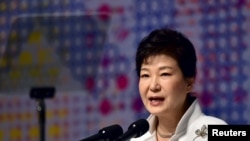 FILE - South Korean President Park Geun-hye delivers a speech in Seoul, March 1, 2016. She accepted the resignations of her chief of staff and the senior secretaries for policy coordination, political affairs, civil affairs and public relations.