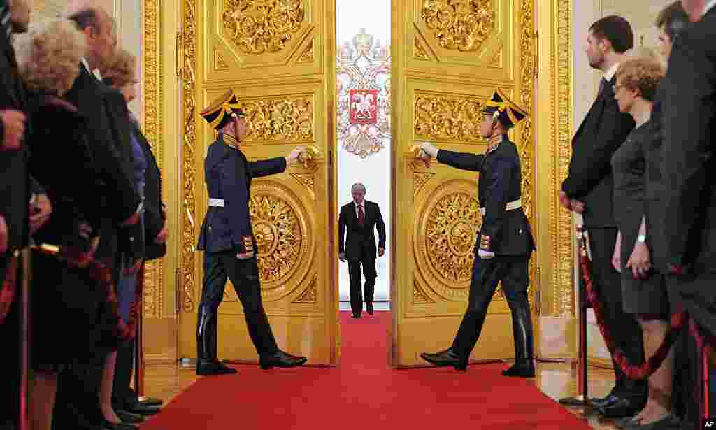 Vladimir Putin enters St. Andrew's Hall to take the oath of office during his inauguration as Russia's president in the Grand Kremlin Palace in Moscow, May 7, 2012. (AP)