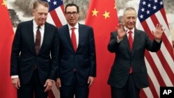 Chinese Vice Premier Liu He, right, gestures as U.S. Treasury Secretary Steven Mnuchin, center, chats with his Trade Representative Robert Lighthizer, left, before they proceed to their meeting at the Diaoyutai State Guesthouse in Beijing, May 1, 2019.