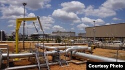 Pipelines criss-cross at the Paloch oil field in South Sudan on Sunday, May 5, 2013, when production resumed at the facility after a 16-month break.