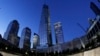 FILE - In this image made with a fisheye lens, One World Trade Center, center, rises above waterfalls at the National September 11 Memorial and Museum, Sept. 8, 2013, in New York.