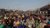 Protesting farmers listen to a speaker at the Delhi- Haryana border, outskirts of New Delhi, India, Dec. 17, 2020.