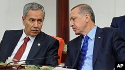 FILE - Turkey's Prime Minister Recep Tayyip Erdogan (r) and his deputy Bulent Arinc. 