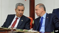FILE - Turkey's Prime Minister Recep Tayyip Erdogan (r) and his deputy Bulent Arinc, Oct. 1, 2012. 