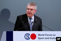 FILE - In this Oct. 20, 2016, photo, International Olympic Committee President Thomas Bach delivers a speech at World Forum on Sports and Culture in Tokyo.