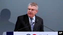 FILE - In this Oct. 20, 2016, photo, International Olympic Committee President Thomas Bach delivers a speech at World Forum on Sports and Culture in Tokyo. 