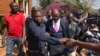 Opposition leader Tendai Biti who early this week fled to Zambia seeking asylum, arrives at the Harare Magistrates Court, Aug 10, 2018, to challenge his deportation from Zambia and his subsequent arrest. (C. Mavhunga for VOA)