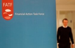 FILE - The logo of the FATF (the Financial Action Task Force) is seen during a news conference in Paris, France, Oct. 18, 2019.