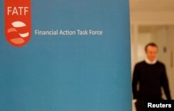 FILE - The logo of the FATF (the Financial Action Task Force) is seen during a news conference in Paris, France, Oct. 18, 2019.