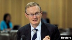 FILE - Australia's Reserve Bank of Australia (RBA) Governor Philip Lowe speaks at a parliamentary economics committee meeting in Sydney, Sept. 22, 2016. 