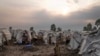 FILE - People displaced by the ongoing fighting gather at refugee camp on the outskirts of Goma, Democratic Republic of the Congo, July 11, 2024.